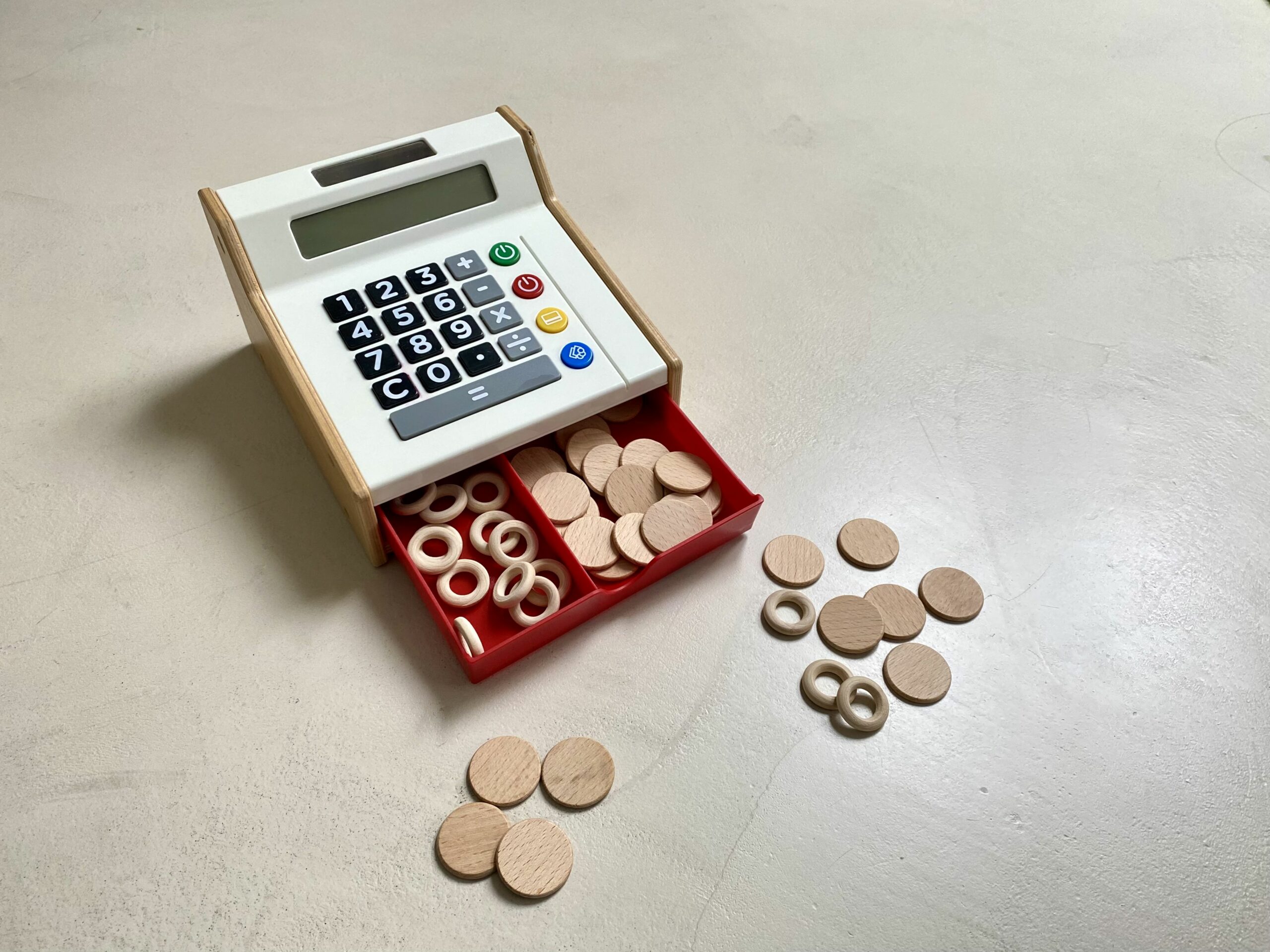 Wooden rings and discs as money in symbolic play